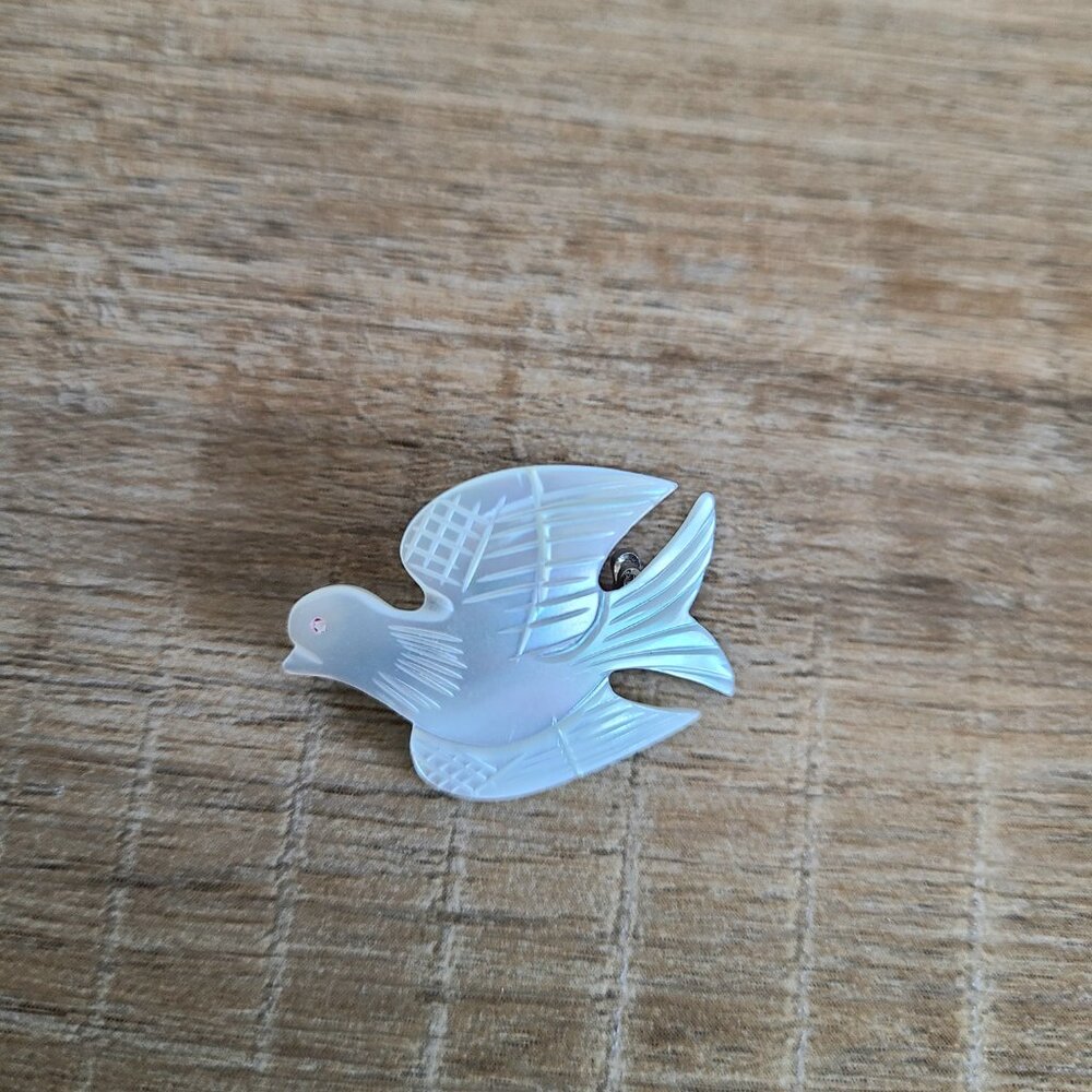 Vintage mother of pearl bird brooch.